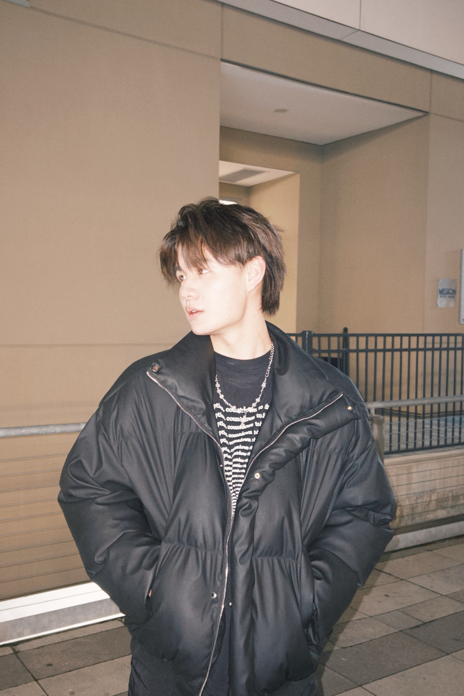 zeebu standing in a black jacket